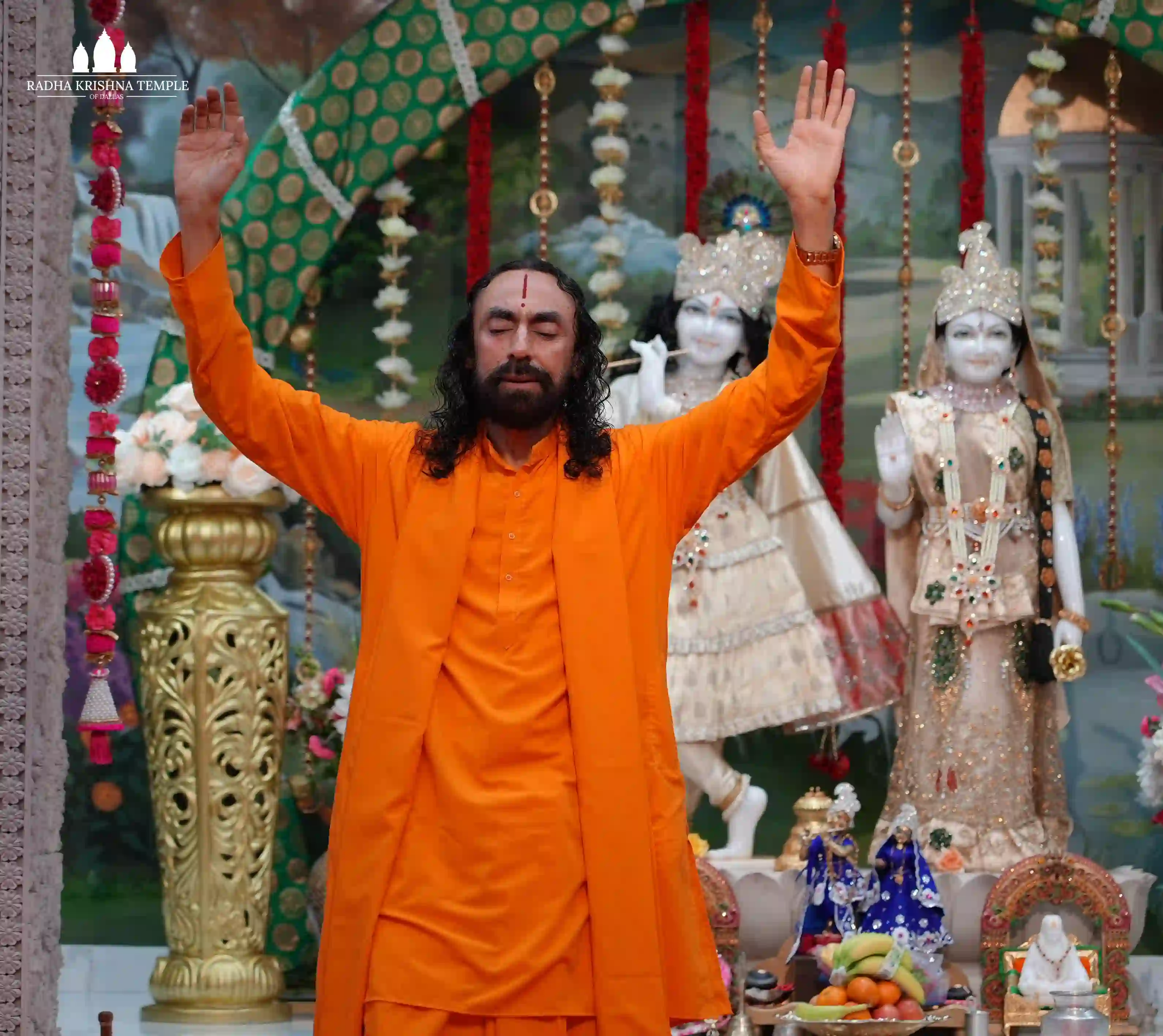 With hands raised in surrender and heart immersed in devotion, Swami ji leads all into the divine presence of Radha-Krishna, where love becomes prayer and prayer becomes union