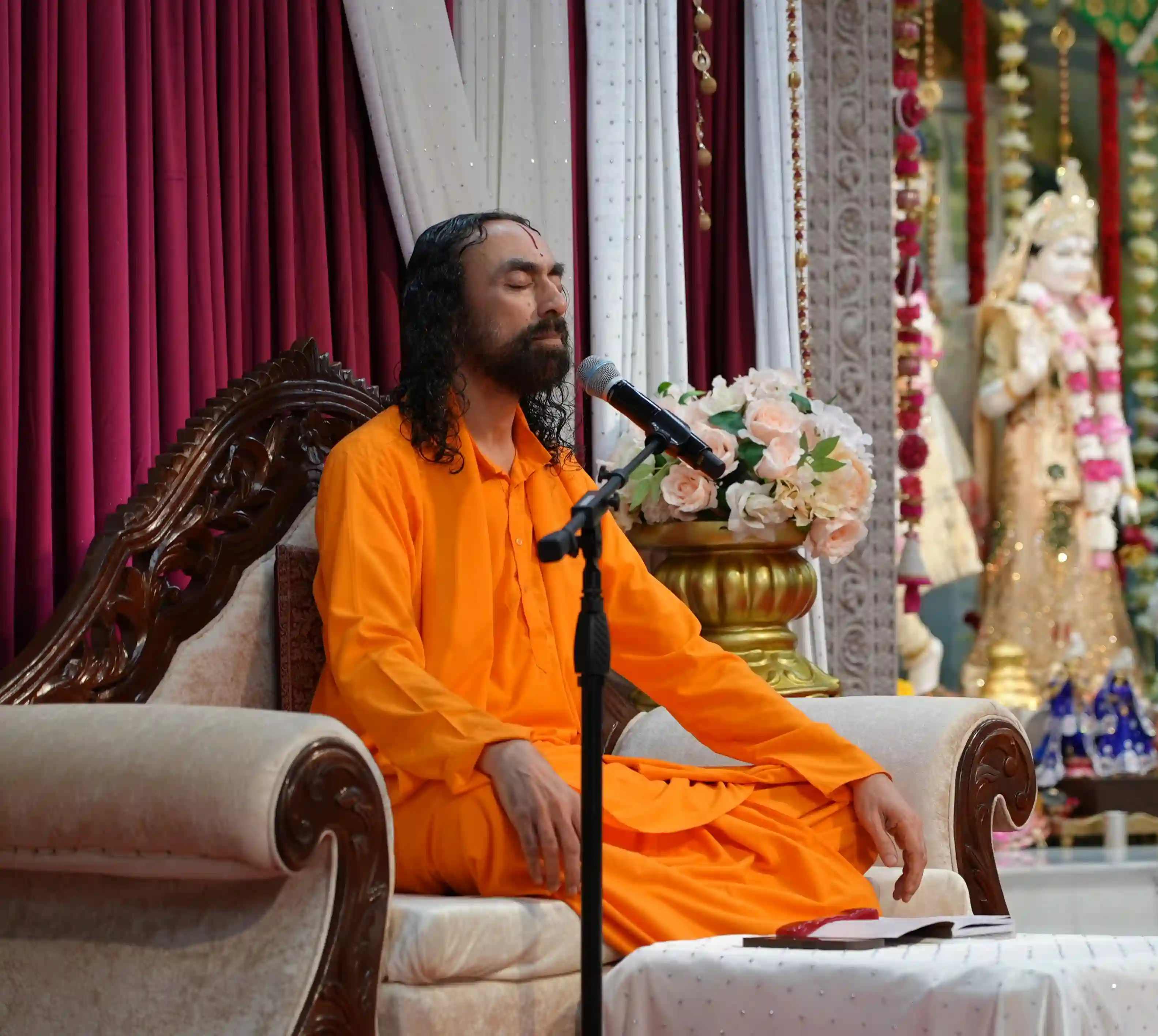 In serene stillness, Swamiji Ji sits absorbed in divine remembrance, guiding hearts through silence, devotion, and the sacred power of kirtan.