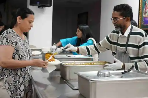 Have Mahaprasad, the blessed food offered to the Divine and shared with all. It nourishes both body and soul, symbolizing unity, gratitude, and the divine grace that flows through every humble bite in a spirit of love and togetherness.