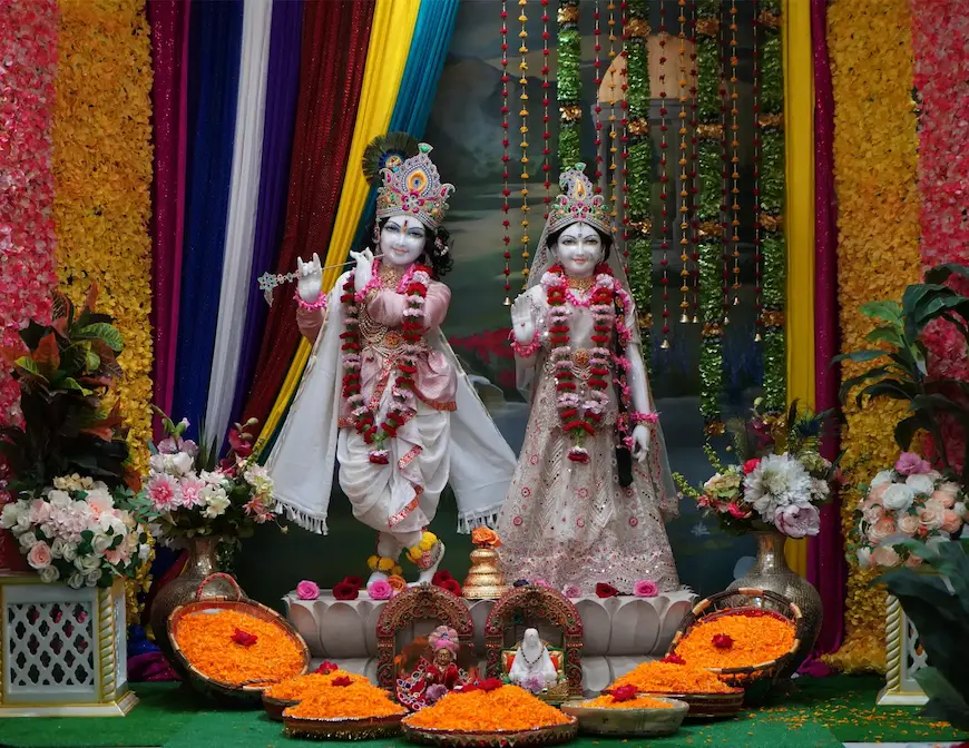 Radha Krishna deities adorned with garlands at the Radha Krishna Temple of Dallas.