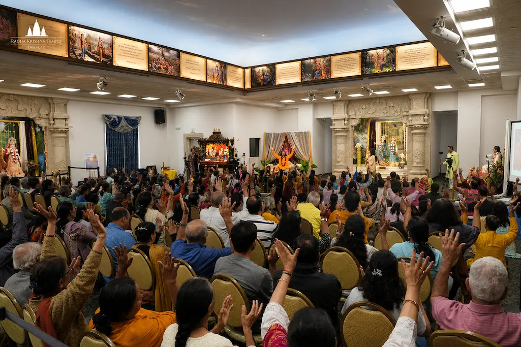 Devotees singing kirtan together during Sunday Satsang at Radha Krishna Temple Dallas