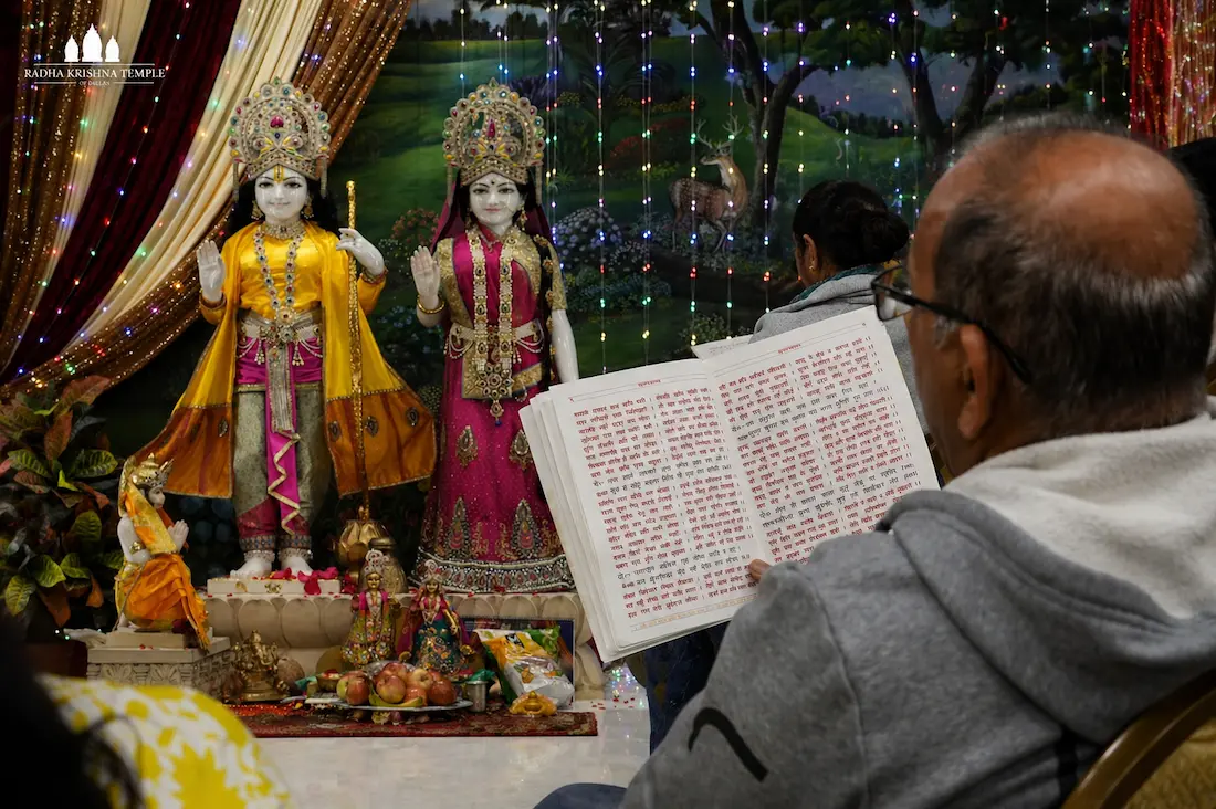 Hanuman ji murti adorned with garlands in temple setting