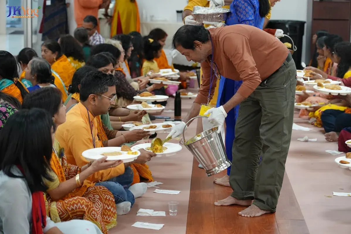 Serving prasadam