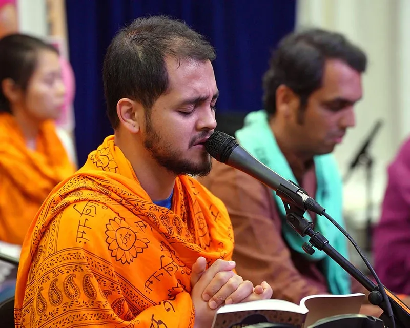 A devotee immersed in kirtan. 