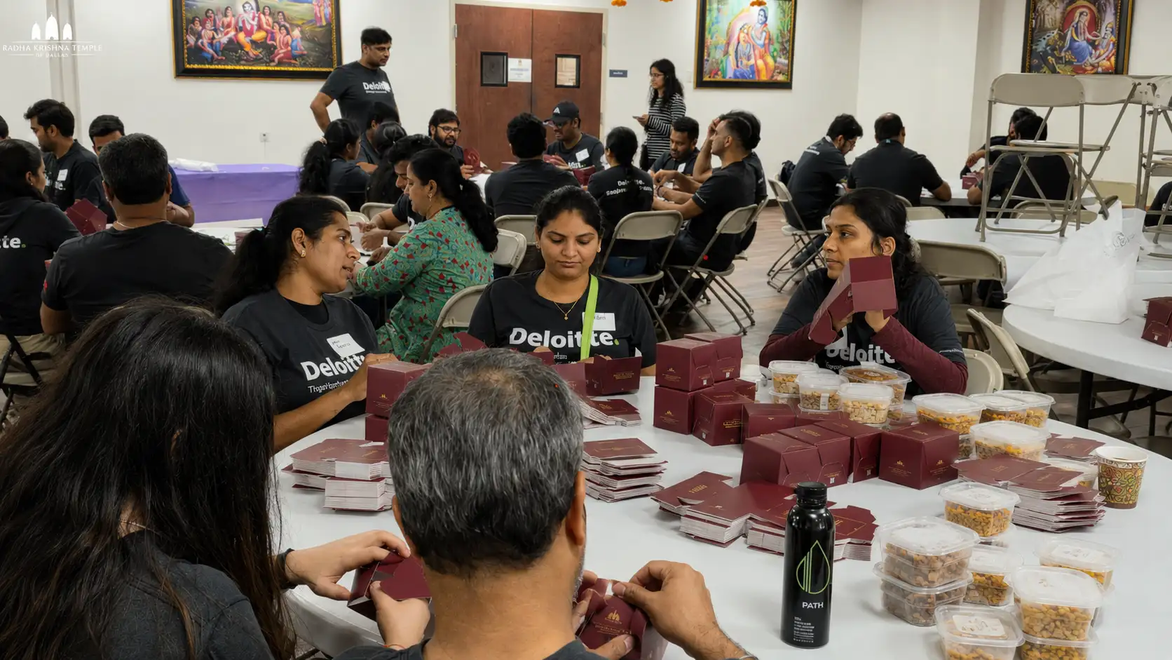 Deloitte Volunteers Provide Support Making Packets for Sri Venkateshwara Swami Pran Pratishtha Mega Event.