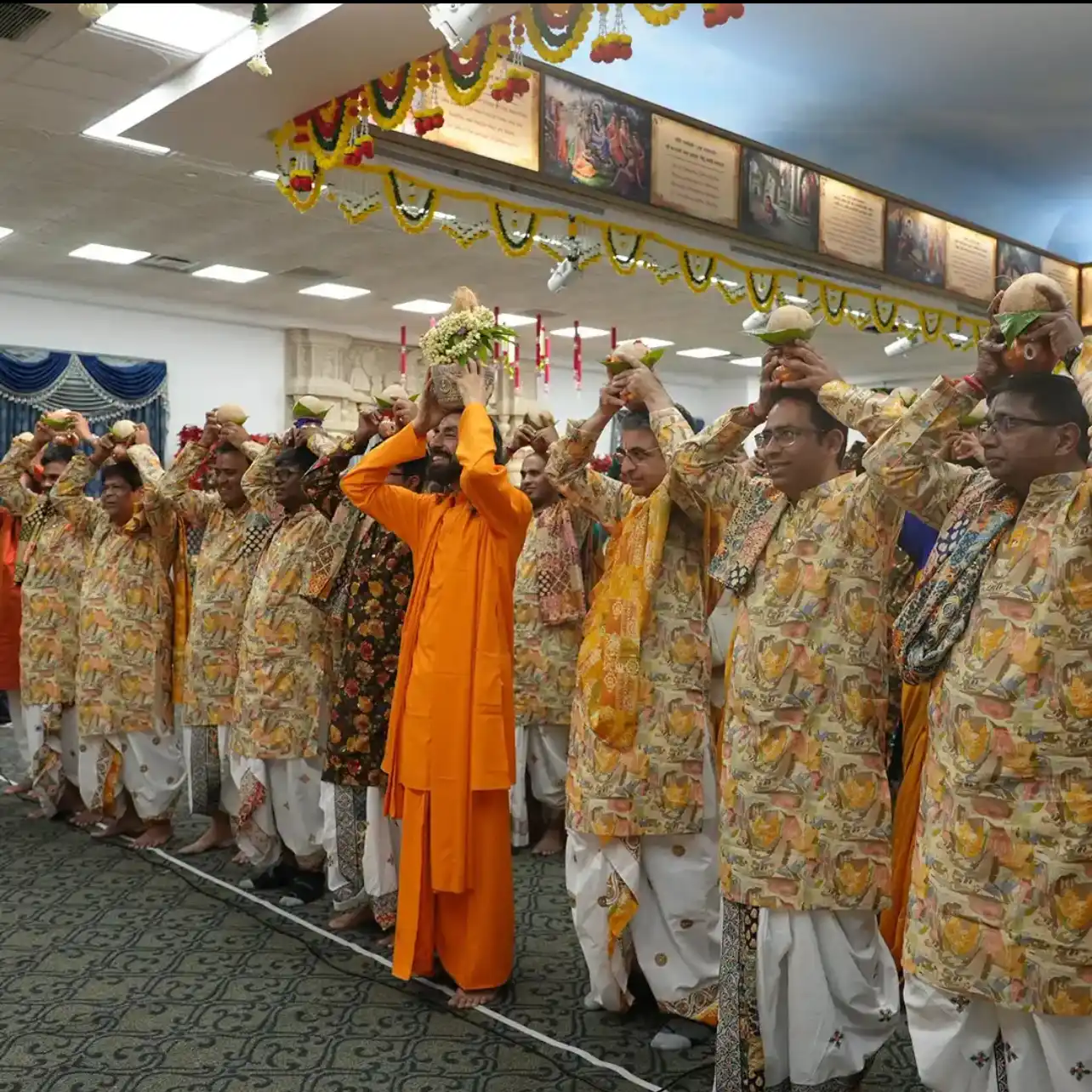 Dressed in vibrant yellow attire blessed by Swami Mukundananda, hundreds of devotees carried sanctified Kalashas filled with sacred river water upon their heads.
