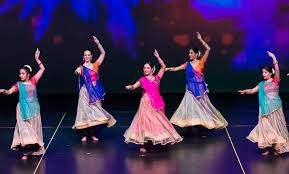 People dancing in the names of Radha Krishna